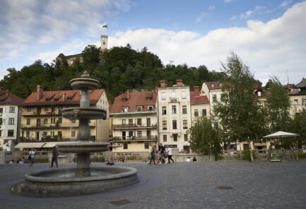 Ljubljana fountain and a luxury spectator Ljubljlana castle