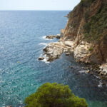 Photography about Tossa de mar d'Es Codolar beach seascape to east, Mediterranean sea direction.