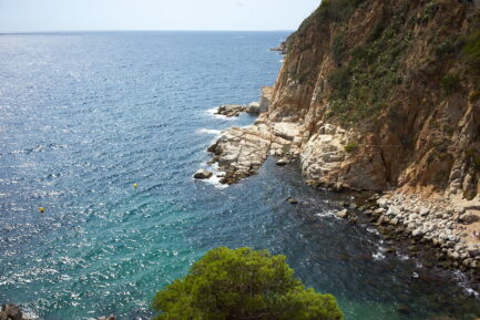 Photography about Tossa de mar d'Es Codolar beach seascape to east, Mediterranean sea direction.