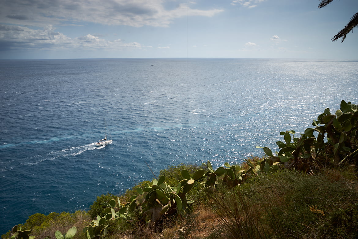 A catamaran sailing near Tossa de Mar