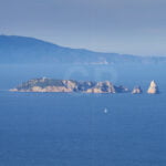 Sailing between Begur and Medes Islands with Montgrí Massif in background