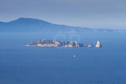 Sailing between Begur and Medes Islands with Montgrí Massif in background