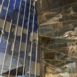 View of multiple scenes reflected in a single building