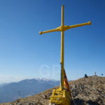 The Taga Mountain Peak cross photograph