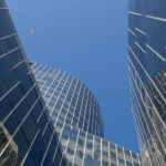 A seagull flying over the gas tower Mare Nostrum Tower