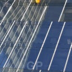 Butterfly Flying Among Blue Crystal Reflections