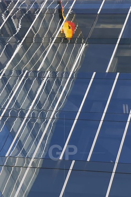 Butterfly Flying Among Blue Crystal Reflections
