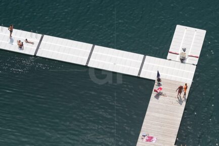 People playing on the walkways of lake Bled from a bird’s-eye view canvas print.