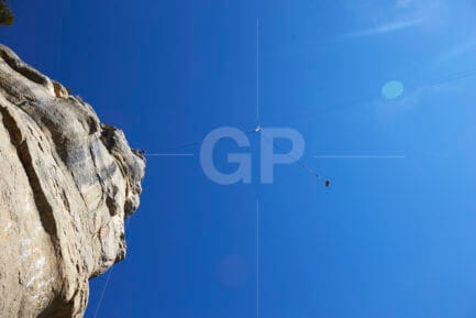 Senior abseilers carefully testing the safety of an installation in Tavertet