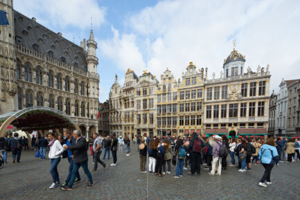 Horizontal photograph of the Maison du Roi d’Espagne with people in Brussels’ Grand Place